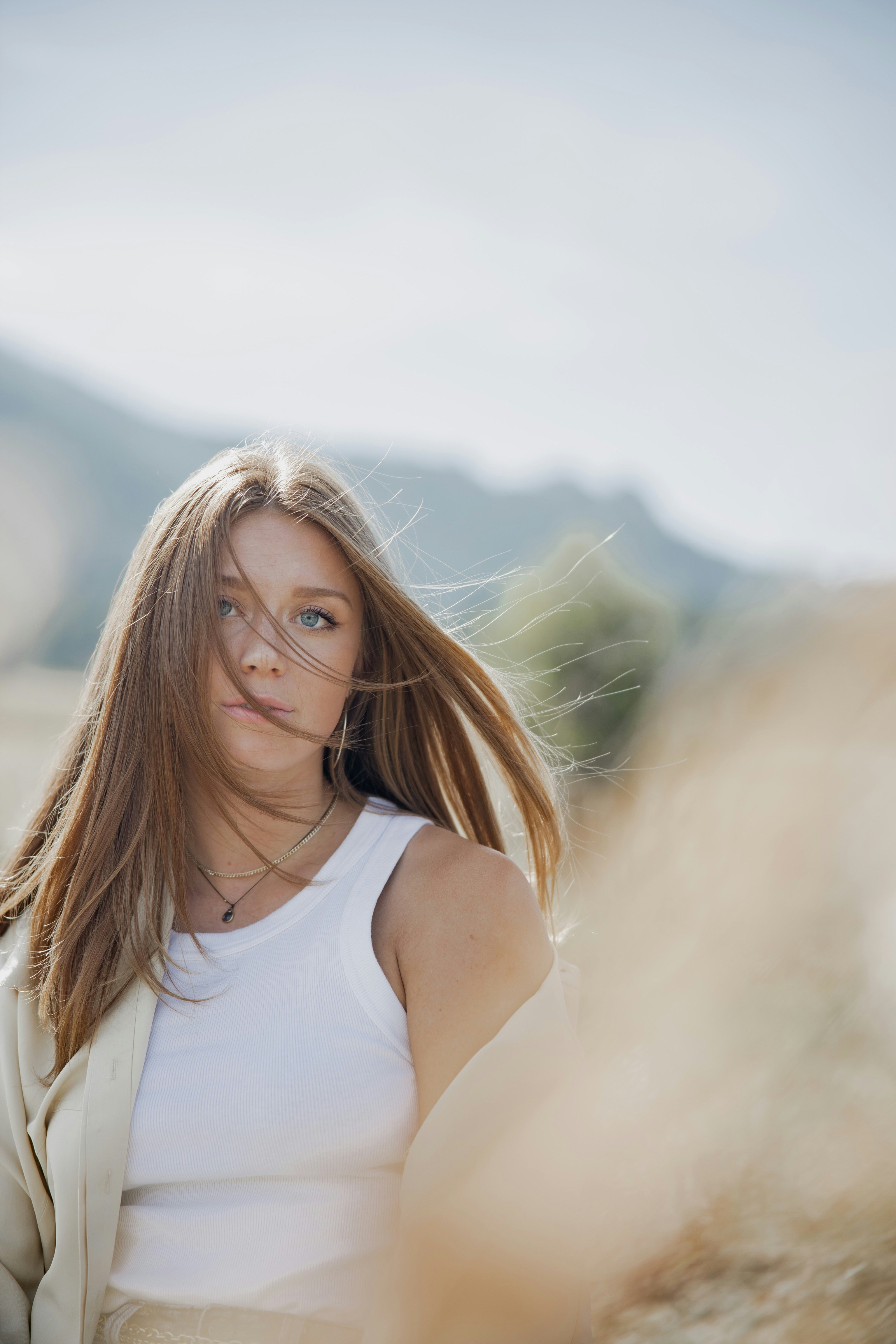 woman in white tank top wearing eyeglasses